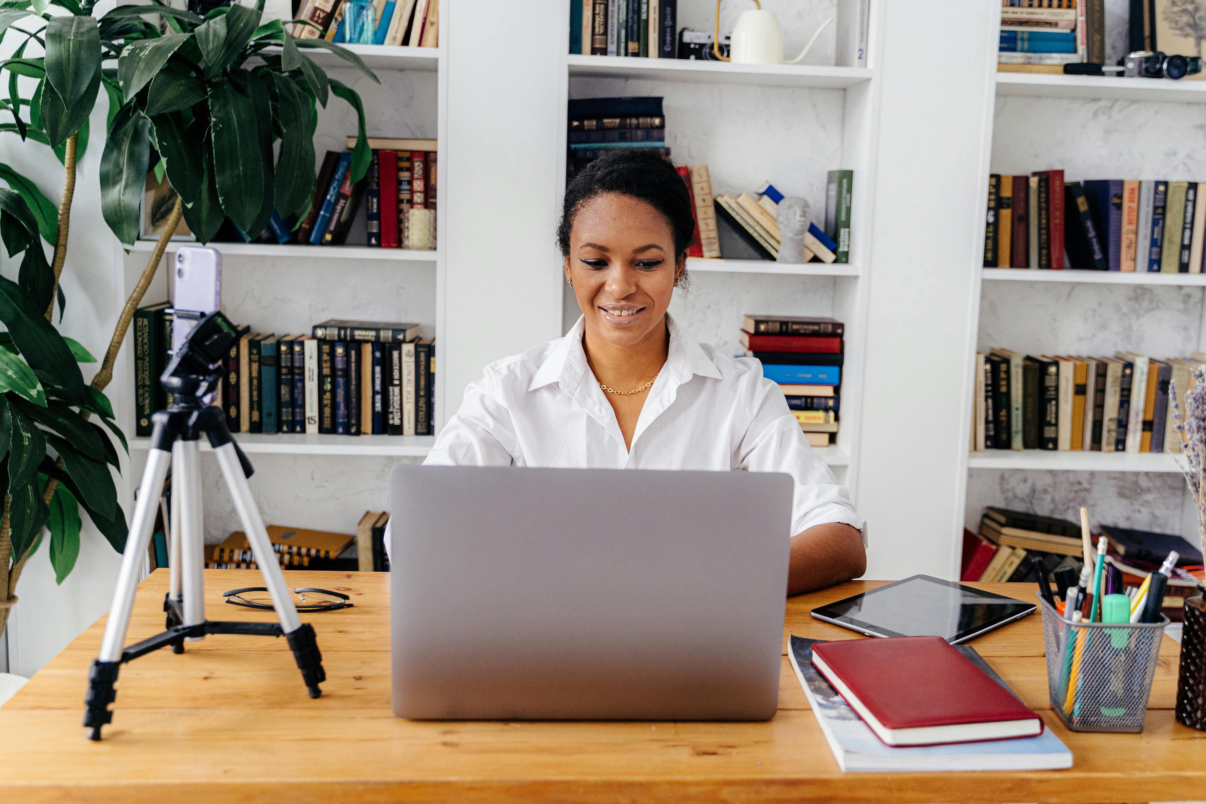 Adult professional studying on a laptop in a bright, modern environment